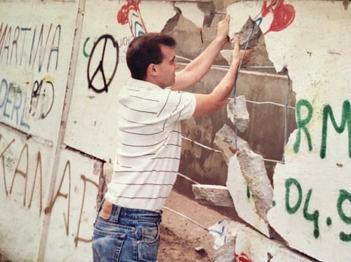 Tearing down Berlin Wall